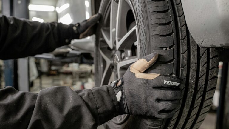 a man working on a tire in a garage