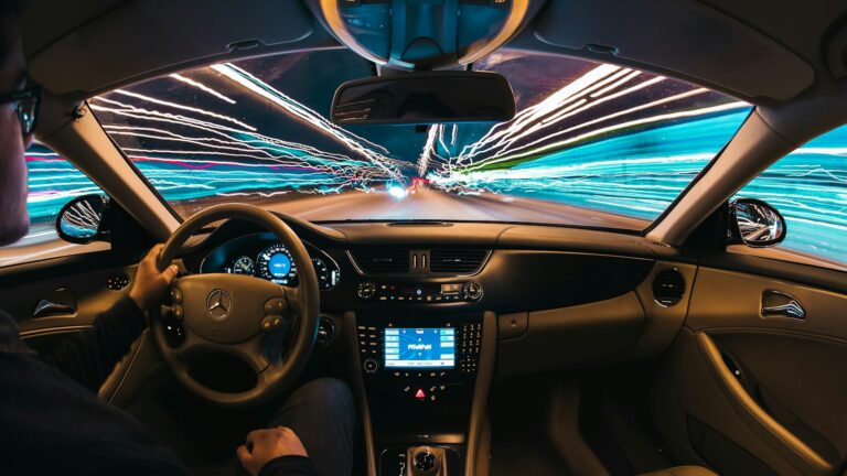 time lapse photography of man riding car